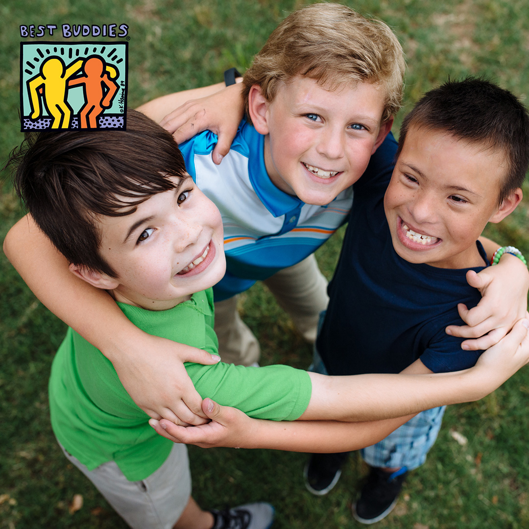 Young group of Best Buddies participants hugging