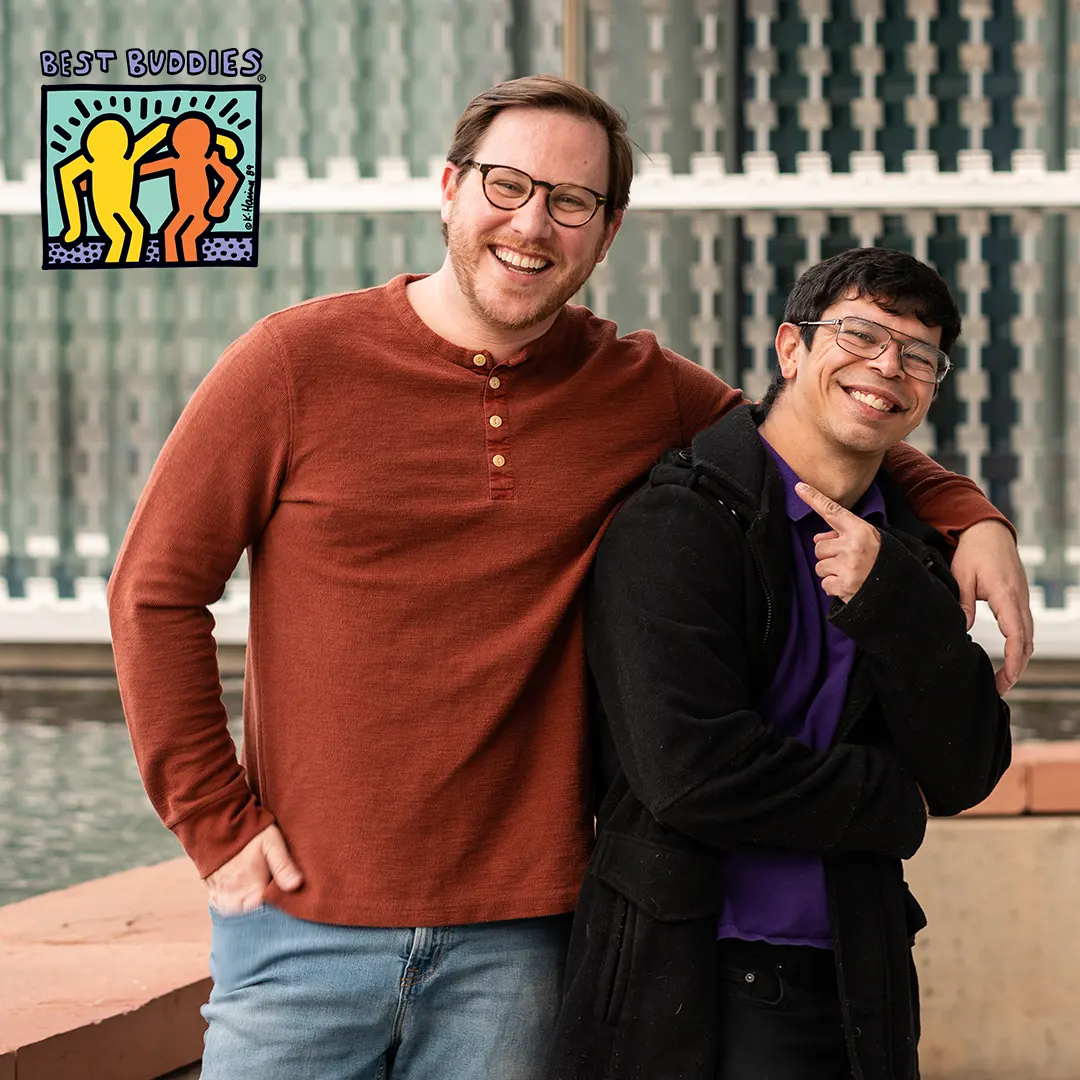 two male Citizen program members with arms across one another's shoulders