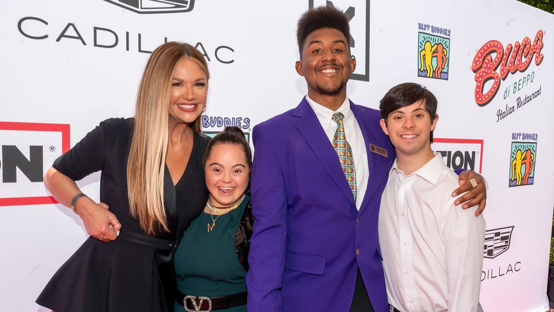 Nancy O'Dell on the red carpet with Best Buddies participants.