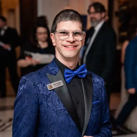 Brett Fleming in a suit at a Best Buddies event