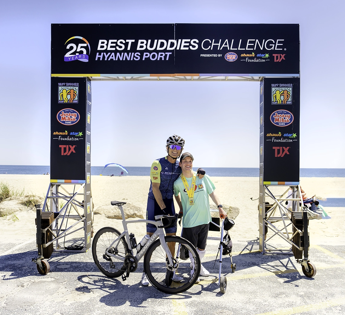 Anthony K. Shriver, Founder, Chairman, and CEO of Best Buddies International poses with a Best Buddies program participant in Hyannis Port, MA.