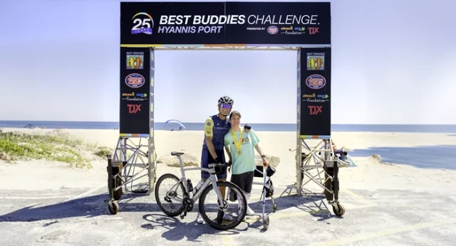 Anthony K. Shriver, Founder, Chairman, and CEO of Best Buddies International poses with a Best Buddies program participant in Hyannis Port, MA.